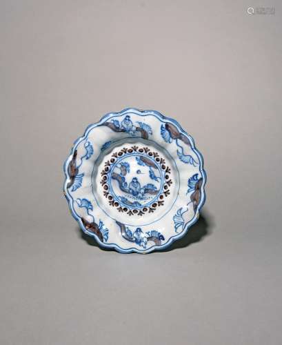 A small delftware lobed dish or cracknell c.1700, painted in...