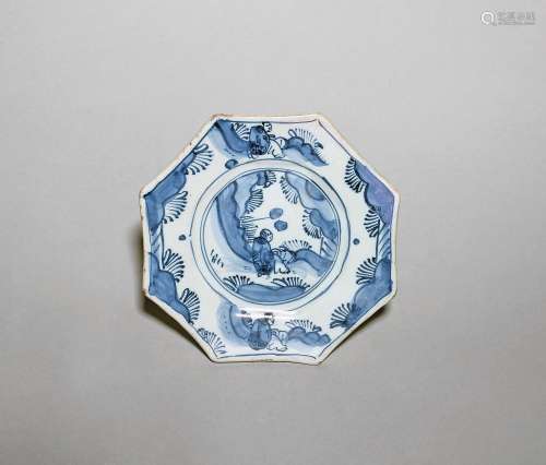A small delftware octagonal plate c.1680, painted in blue wi...