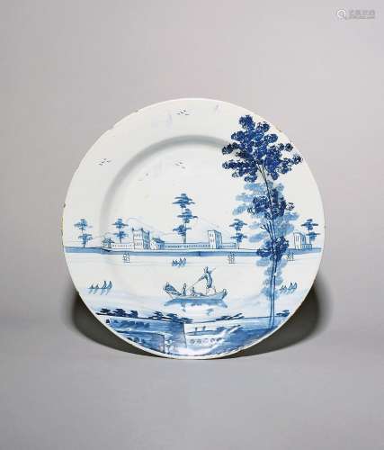 A Bristol delftware charger c.1760, painted in blue with fig...