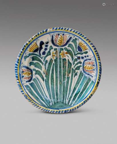 A delftware tulip charger of small size c.1690, probably Lon...