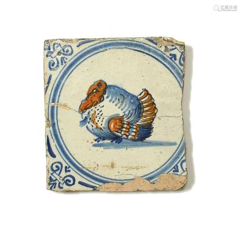 A Delft tile c.1660-80, painted in blue and ochre with a tur...