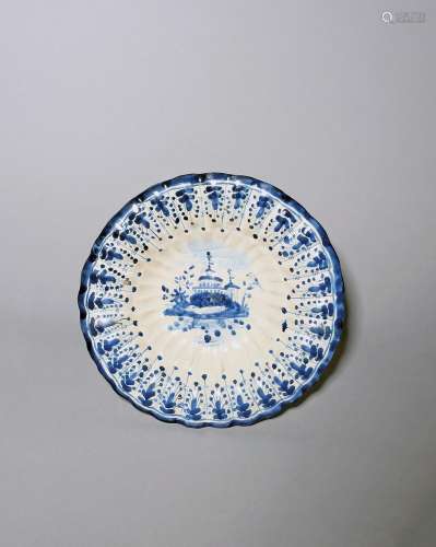 A lobed faïence dish c.1690-1700, probably Portuguese, the w...