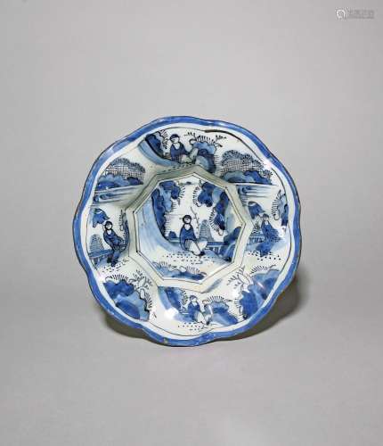 A Delft lobed dish c.1690, the octagonal well painted in blu...