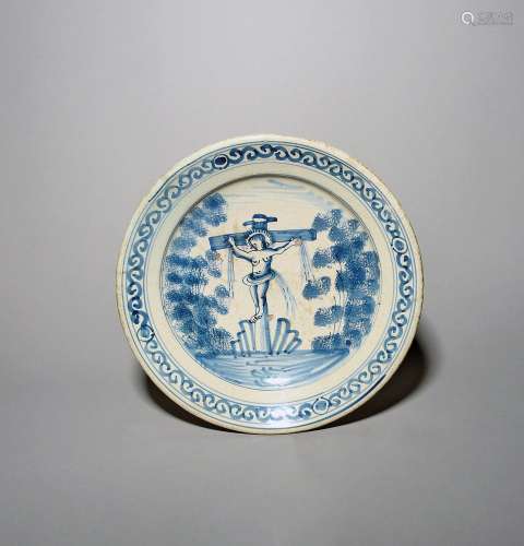 A Delft Crucifixion charger c.1690, painted in blue with Chr...