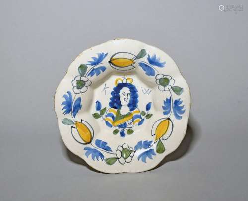 A small Delft lobed dish c.1690, painted in blue, green and ...