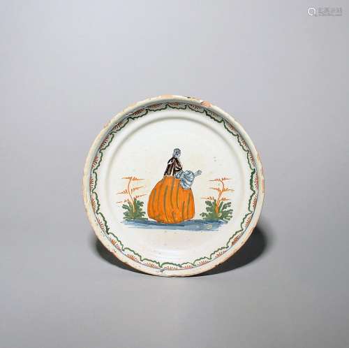 A French faïence dish mid 18th century, painted in blue, man...