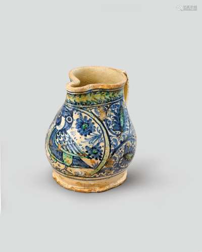 A Montelupo maiolica jug c.15th century, the swollen body si...