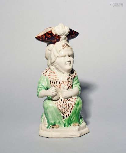 A Ralph Wood Toby jug of Martha Gunn c.1780, seated and hold...