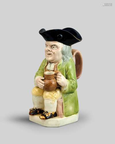 A Ralph Wood Toby jug c.1790, seated with an empty round-bel...