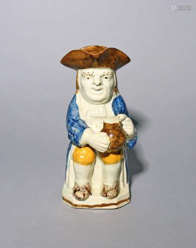 A Pratt ware Toby jug c.1800, seated with a foaming jug of a...