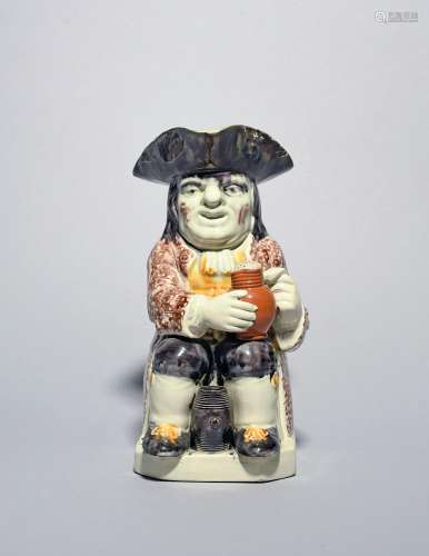 A Wood type Toby jug c.1790-1800, seated with an upright bar...