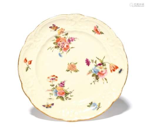 A Nantgarw plate c.1815-20, the well painted with three flor...