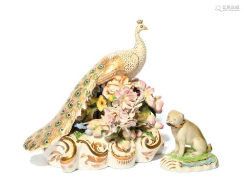 A Derby porcelain figure of a peacock c.1820, raised on a ta...