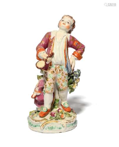 A rare Bow figure of a boy c.1770, standing with his left ha...