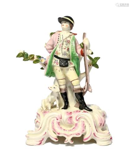 A Bow figure of a huntsman c.1760-65, wearing a peaked hat a...