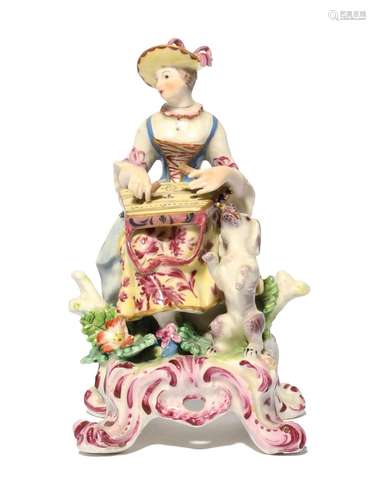 A Bow figure of a female musician c.1762-65, seated and play...