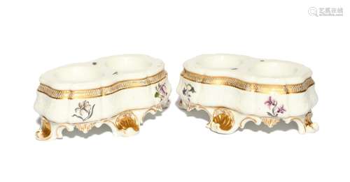 A pair of Meissen double salts c.1740, the shaped oval forms...