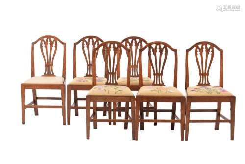 A SET OF SIX GEORGE III ELM DINING CHAIRS