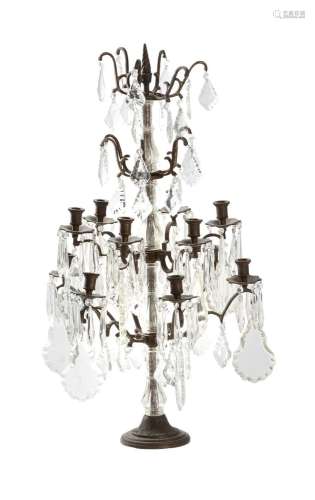 A CUT GLASS AND PATINATED METAL TWELVE LIGHT-CANDELABRA, IN ...