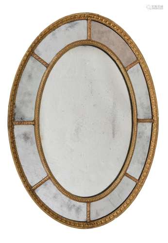 A GILTWOOD AND GESSO OVAL WALL MIRROR