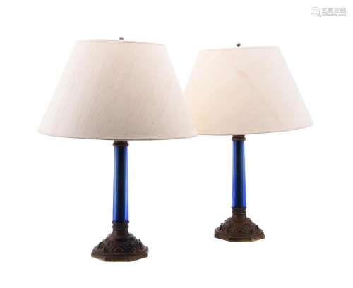 A PAIR OF BLUE GLASS AND PATINATED METAL COLUMNAR TABLE LAMP...