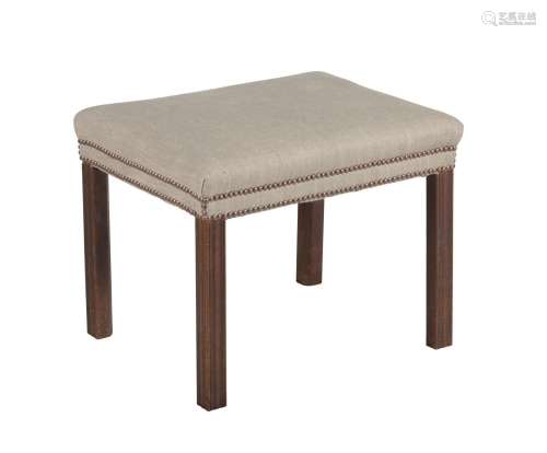 A GEORGE III MAHOGANY AND UPHOLSTERED STOOL