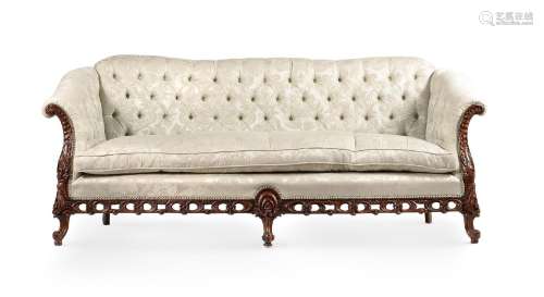A CARVED WALNUT AND UPHOLSTERED SOFA