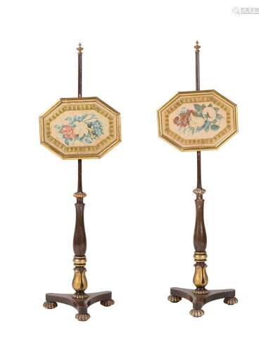 A PAIR OF GEORGE IV SIMULATED ROSEWOOD AND PARCEL GILT POLES...
