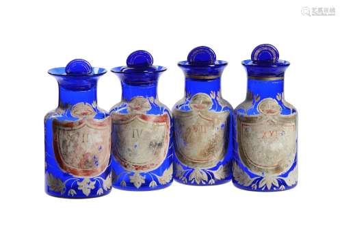 A SET OF FOUR BLUE GLASS AND ENAMELLED APOTHECARY JARS