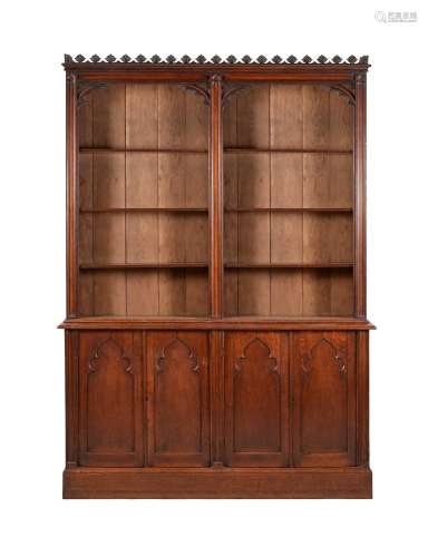 A VICTORIAN STAINED OAK BOOKCASE IN GOTHIC TASTE
