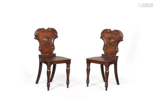 A PAIR OF WILLIAM IV MAHOGANY HALL CHAIRS