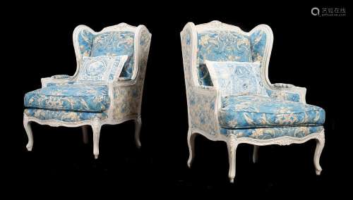 A PAIR OF FRENCH PAINTED WOOD AND UPHOLSTERED ARMCHAIRS IN L...
