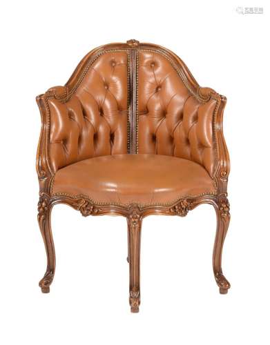 A FRENCH WALNUT AND LEATHER UPHOLSTERED CORNER CHAIR IN LOUI...