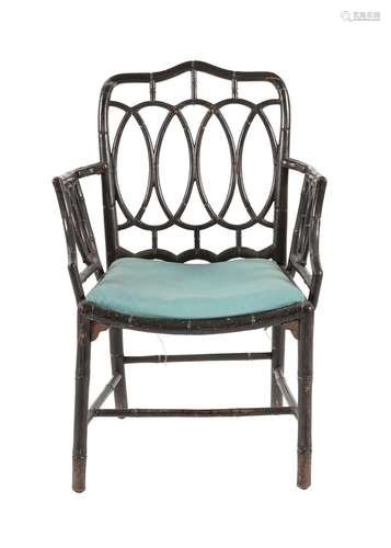 A REGENCY BLACK LACQUERED BAMBOO ARMCHAIR