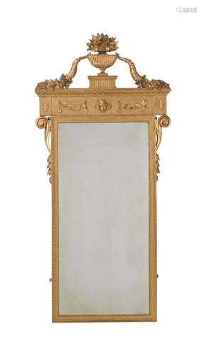 A GILTWOOD AND COMPOSITION PIER MIRROR IN NEO-CLASSICAL TAST...