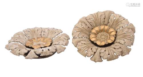 A PAIR OF PAINTED AND PARCEL GILT COMPOSITION CEILING ROSES