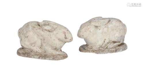 A PAIR OF PAINTED COMPOSITE STONE MODELS OF WHITE RABBITS, 2...