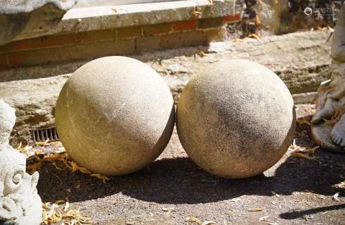 A PAIR OF COMPOSITION STONE SPHERES