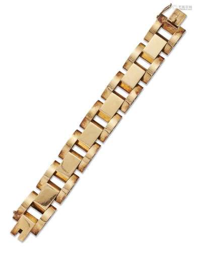 A broad bracelet, of large rectangular and domed articulated...