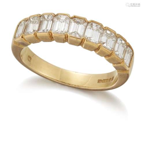A baguette diamond half eternity ring, composed of a line of...