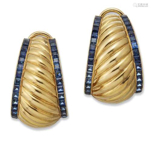 A pair of continental, sapphire ear clips, each designed as ...