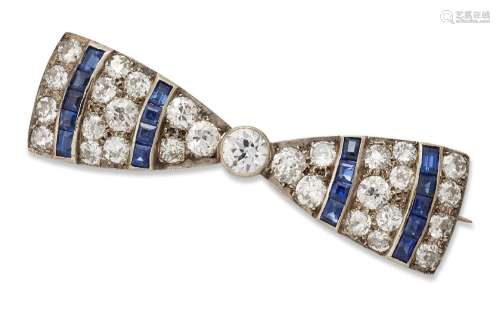 A diamond bow brooch, designed as a ribbon tied bow set with...