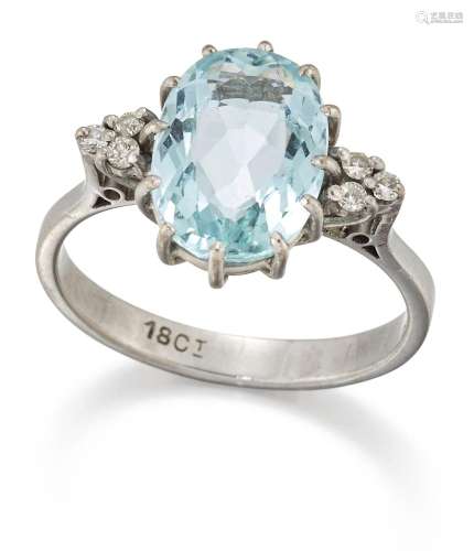 An aquamarine and diamond ring. the single oval-mixed-cut aq...