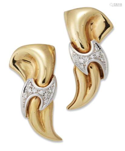 A pair of Italian, diamond earrings, each of scroll design w...