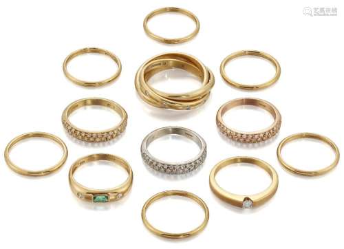 Twelve various diamond and plain band rings, including: a di...