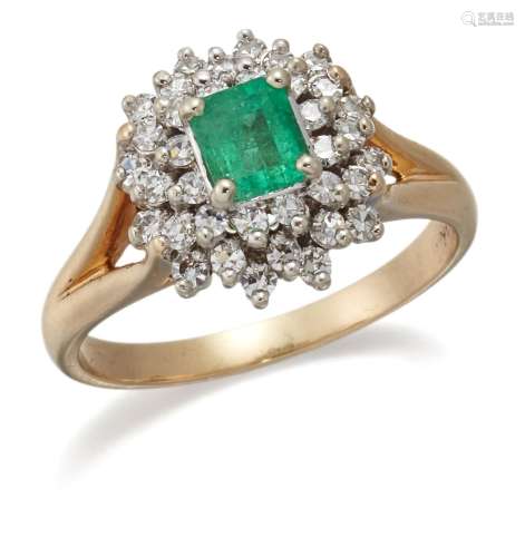 An emerald and diamond cluster ring, the central claw-set re...
