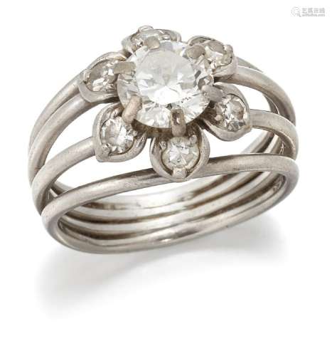 A diamond flower head cluster ring. composed of a central cl...