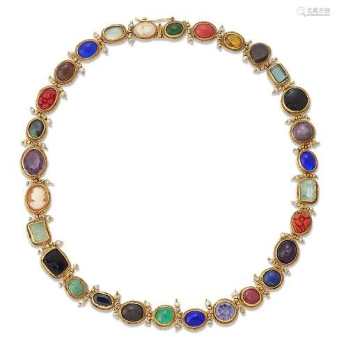 A gem-set necklace, designed as a series of oval gem-stones,...