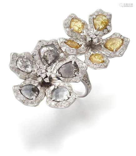 A diamond double cluster ring, designed as two flowers of cr...