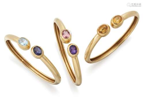 Kiki McDonough, three gem-set bangles, each of torque design...